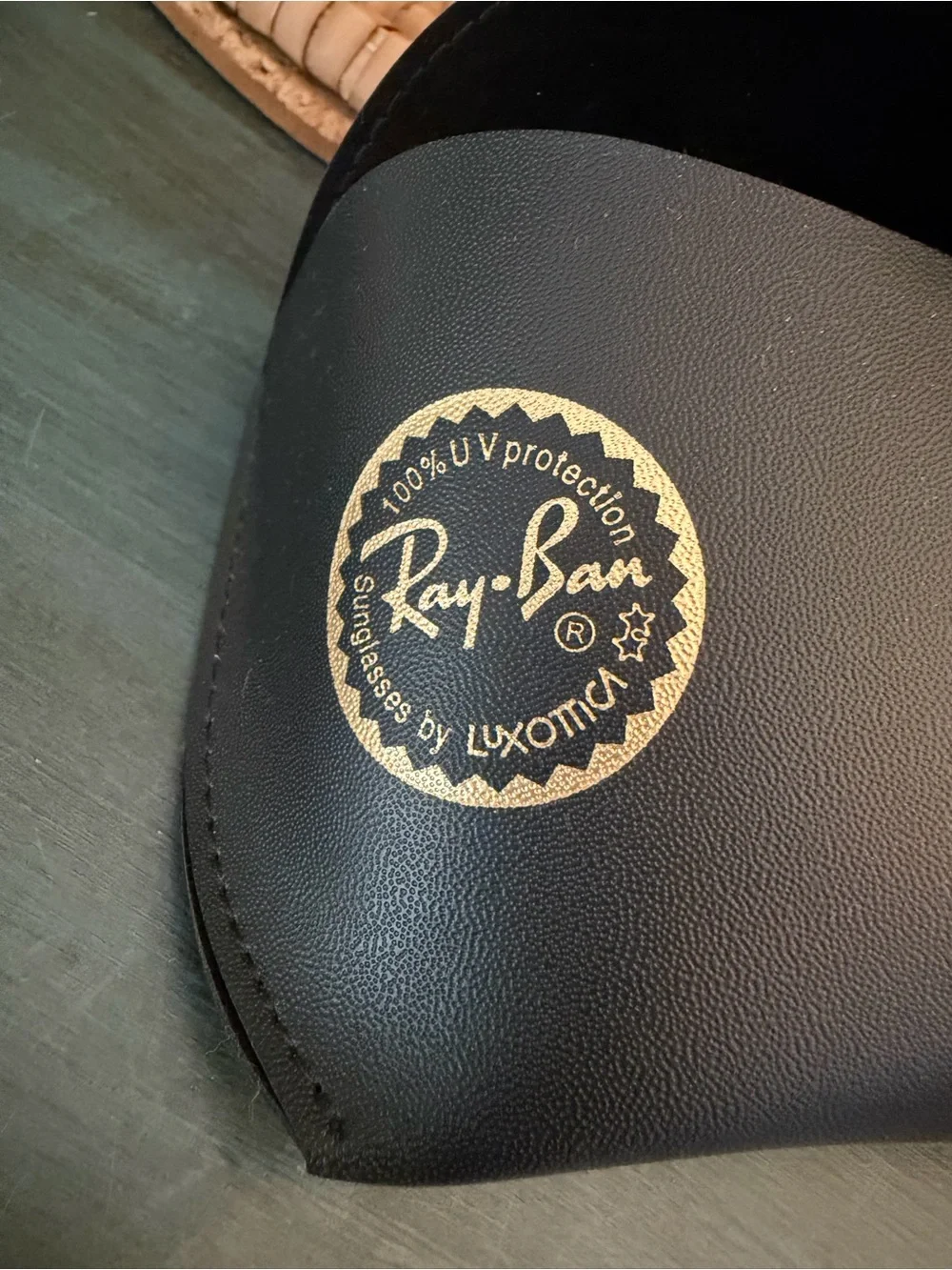 Ray-Ban Sunglasses case with signature gold snap closure. Glass cleaning cloth